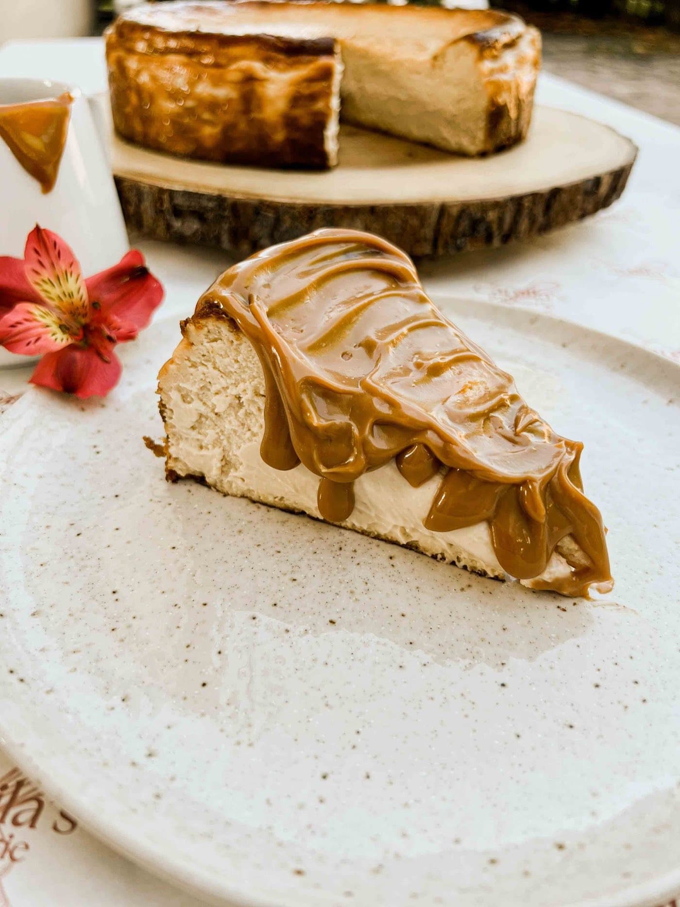 Dulce de leche Basque cheesecake slice plated with caramel drizzle for a fine-dining dessert menu